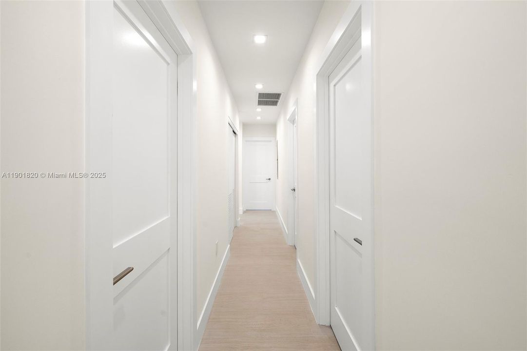 Hallway to Third, Fourth & Primary Bedrooms