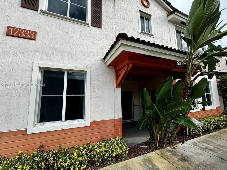 Private porch with access from Dining and Living Room
