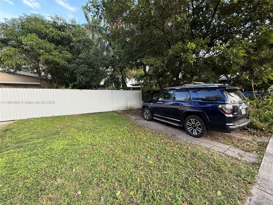 Front Yard with more parking and a double wide gate to pull in your boat, maybe park your commercial vehicle here for additional exposure, NO HOA.