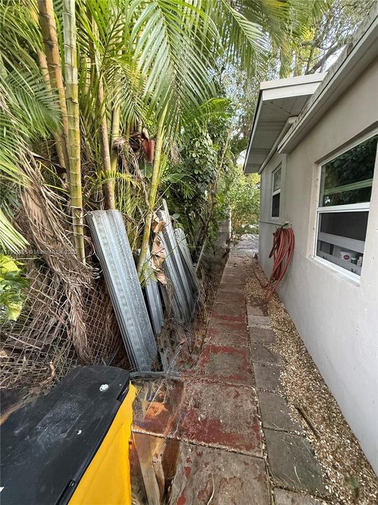 Side yard with Dade County Rated Hurricane Shutters