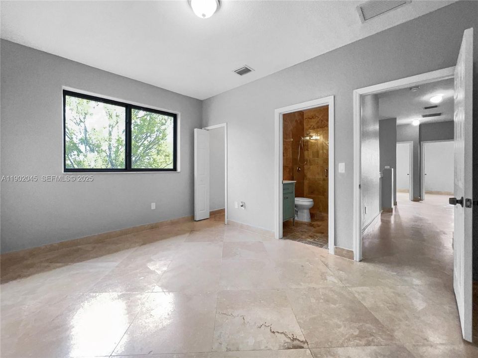 Bedroom 3 with Private Bathroom & Walk-in Closet.