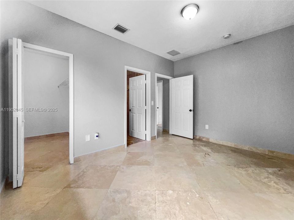 Bedroom 3 with Private Bathroom & Walk-in Closet.