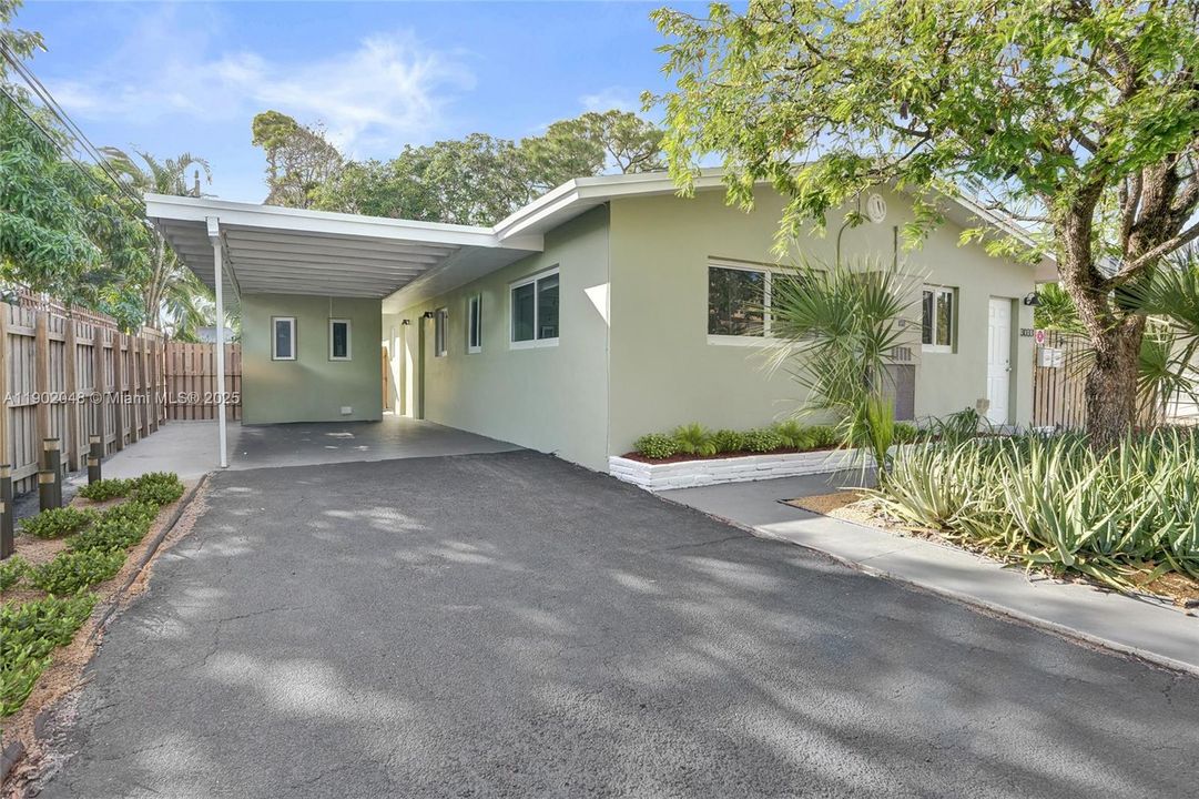 Unit 1 - Carport & drive way for 2 vehicles. 4 additional parkings for the property. **Partially virtual enhanced