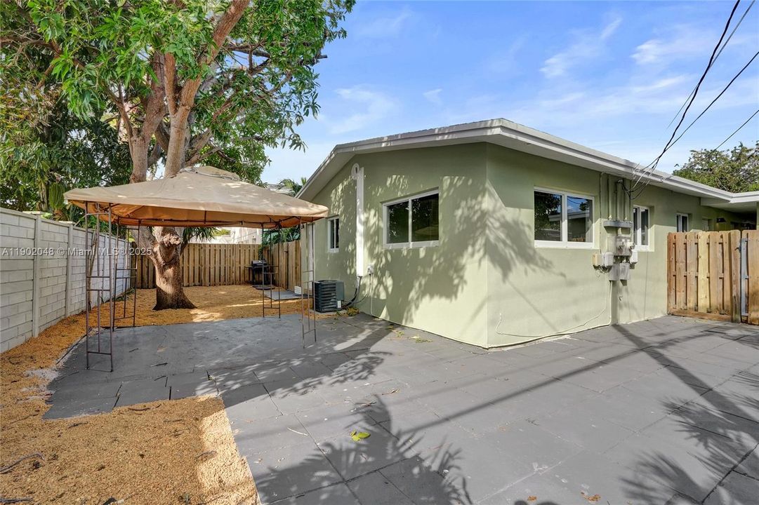 Unit 2 - Private fully enclosed large wrap around back yard. West & south side of unit.