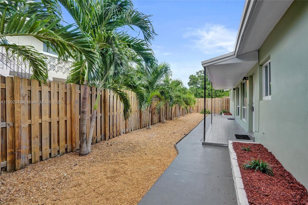 Front entrances of residences. Unit 2's private backyard is behind you as you stand here.