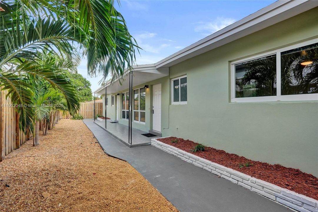 Front entrances of residences. Unit 2's private backyard is behind you as you stand here.