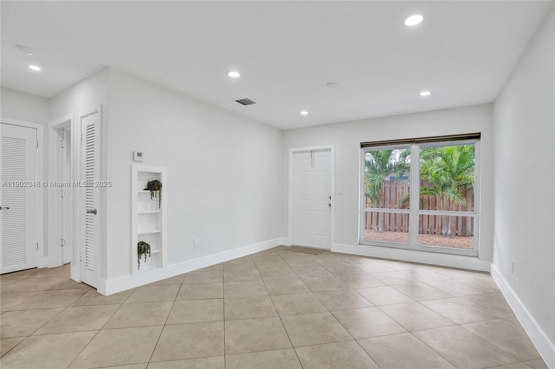 Unit 2 - Living space & entry, view from the dining area.