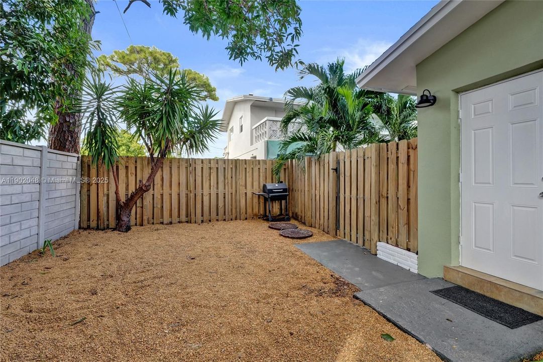 Unit 2 - Private fully enclosed large wrap around back yard. West side of unit.