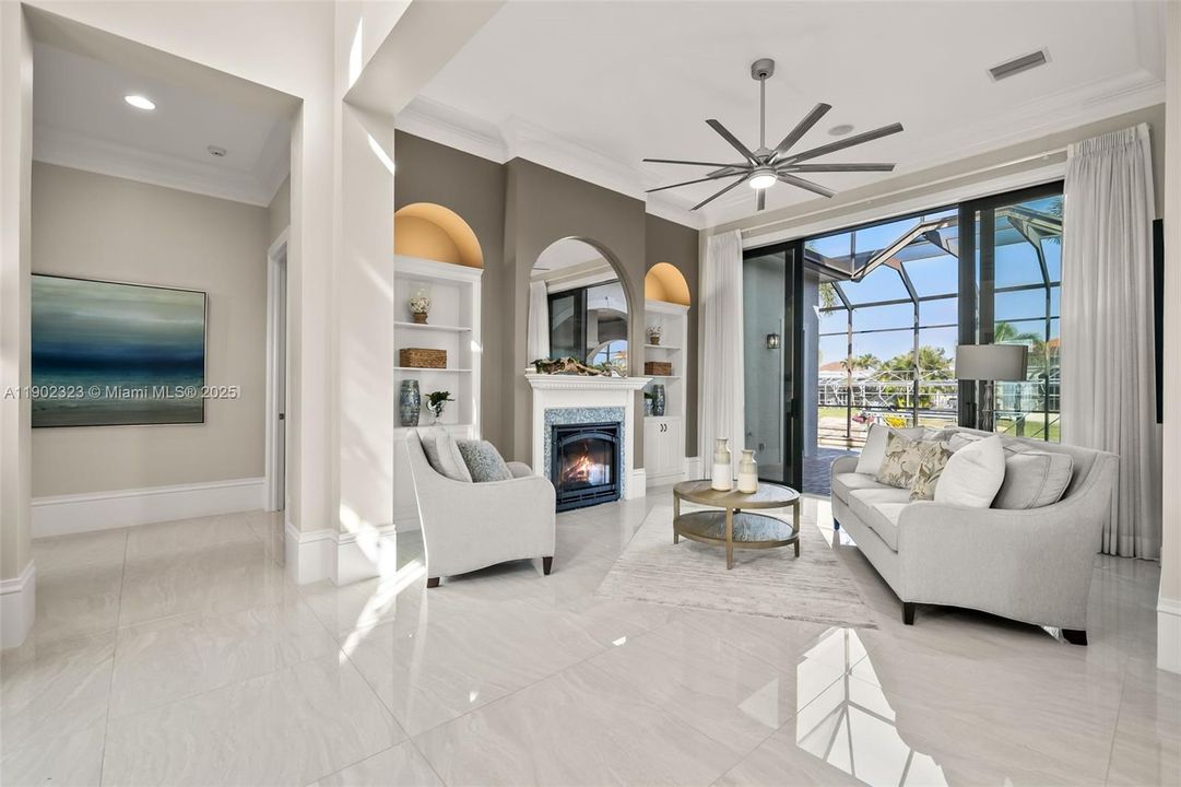 Living room with Gas Fireplace opens to the Lanai