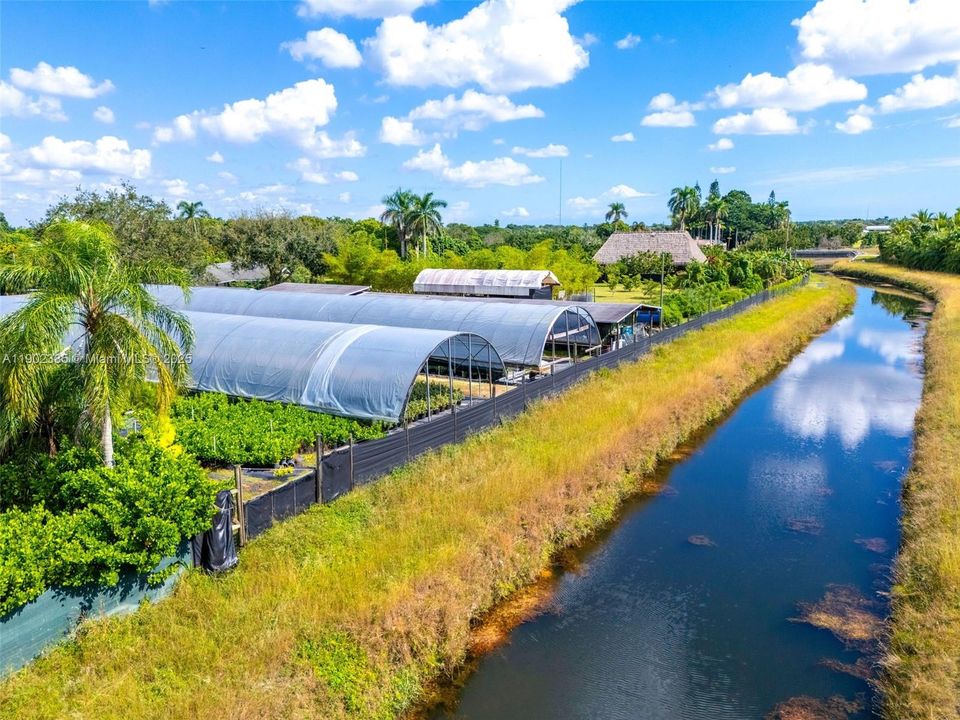 BACK OF THE SHADE HOUSES BACKING TO A CANAL.