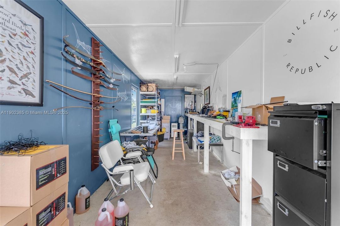INTERIOR OF THE OFFICE IN THE CONTAINER OFF OF THE SHADE HOUSES.