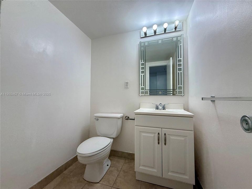 Half bathroom by entrance