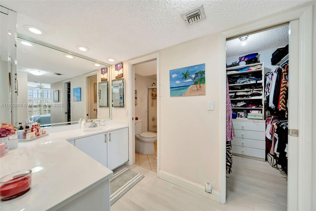 Directly off the vanity, you’ll find easy access to the walk-in closet, private water closet, and bedroom — all connected for comfort and flow. Everything you need is right where you need it.