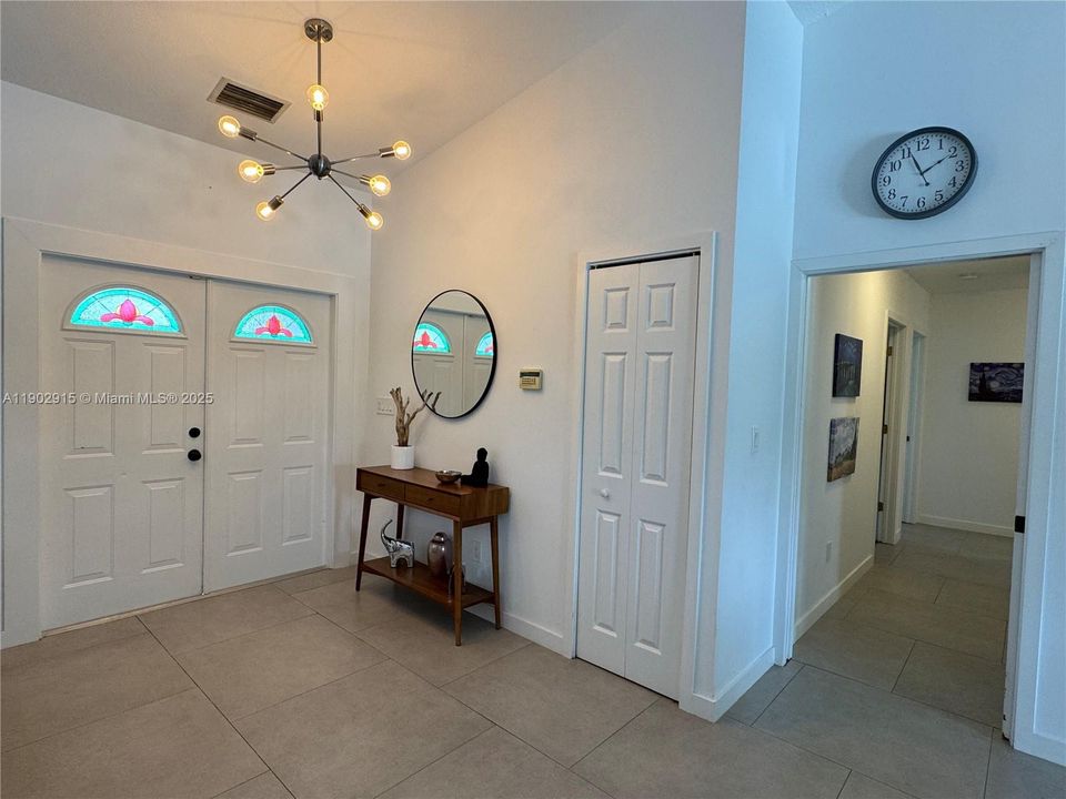 Living area to bedroom hallway and entry