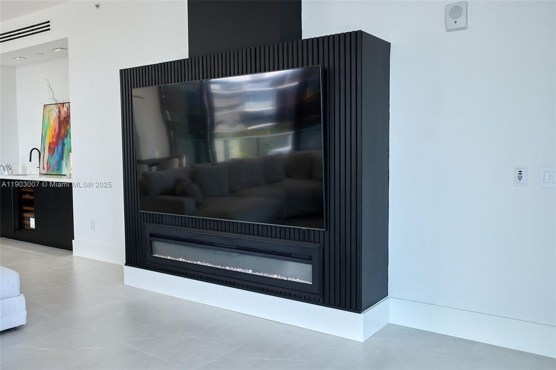 Wood slat back for mounted TV and fireplace