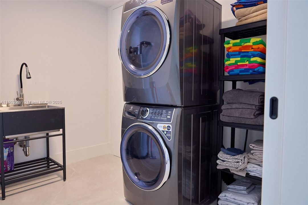 Separate laundry room with laundry tub