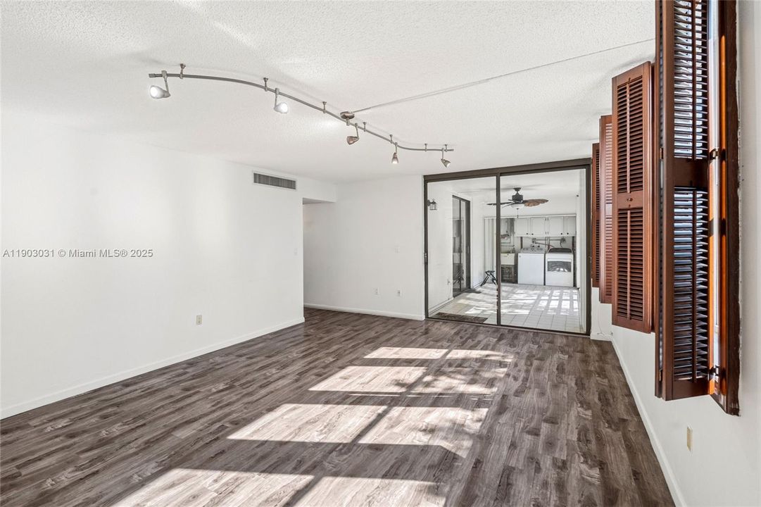 Living area facing open terrace