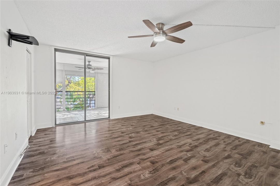 Large bedroom with balcony access