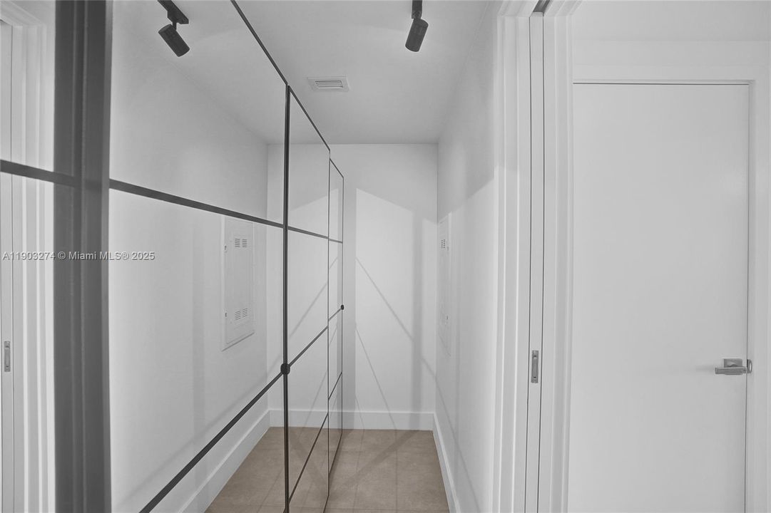Full width closet system with custom mirrors