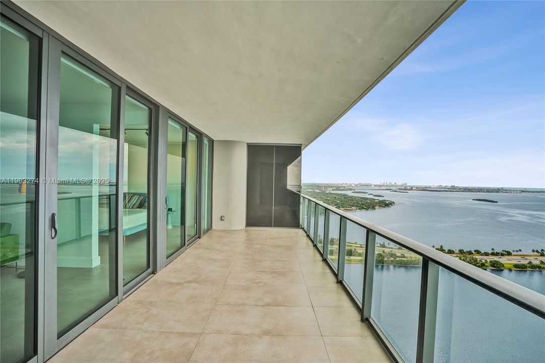 The balcony is accessible from both the living room and master bedroom.