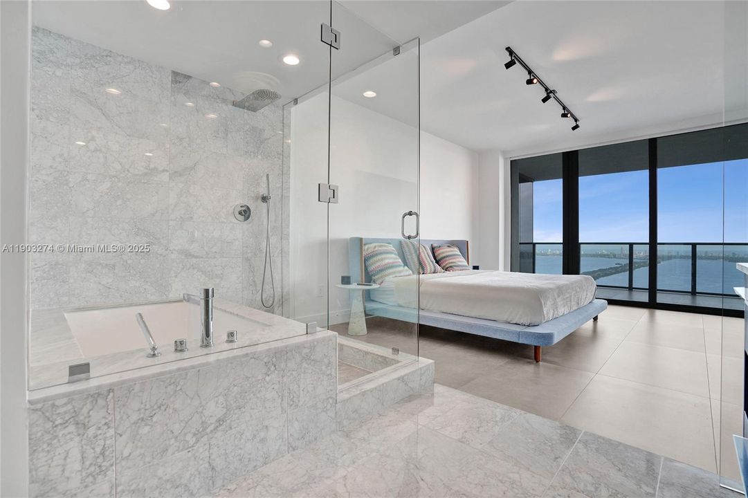 Master Bathroom has a tub and rain shower.