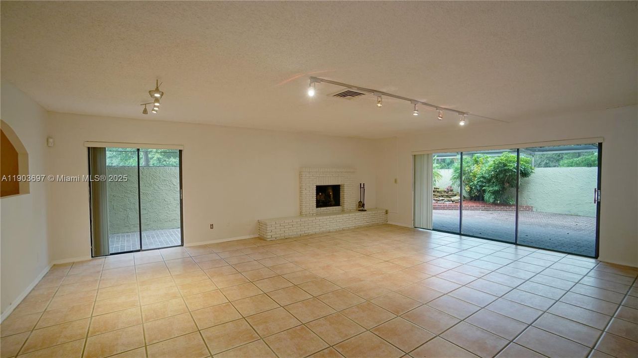 Spacious great room with working fireplace.