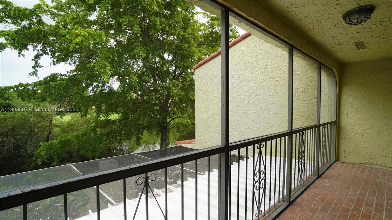 Master bedroom balcony with view to lake.