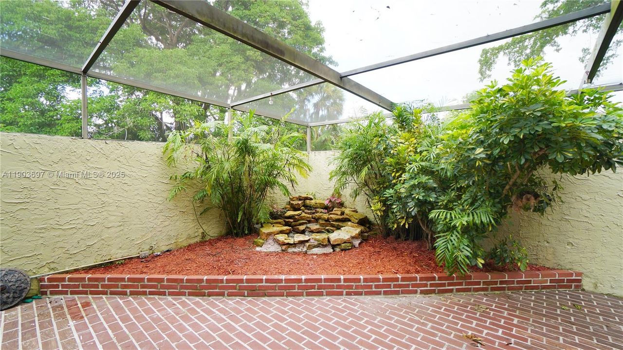 Corner of the patio with waterfall.