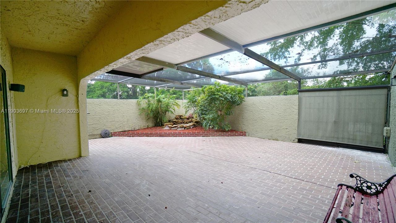 Huge tiled fully screened terrace. Roll-up screen in down position for total privacy.