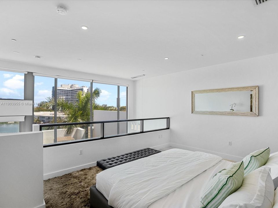 Master bedroom overlooking the water and private roof top