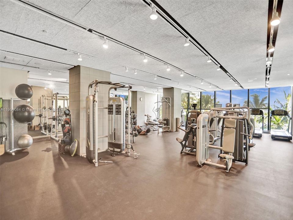 Spacious gym with professional equipment for strength and conditioning.