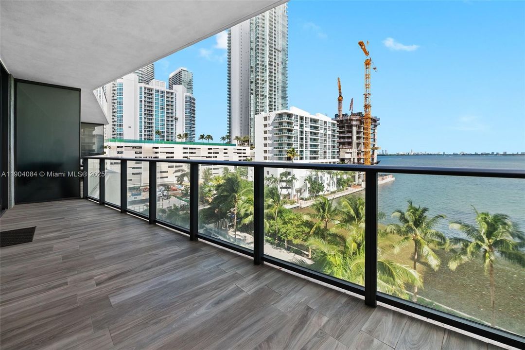 Large private balcony perfect for relaxing or entertaining while enjoying stunning water views.