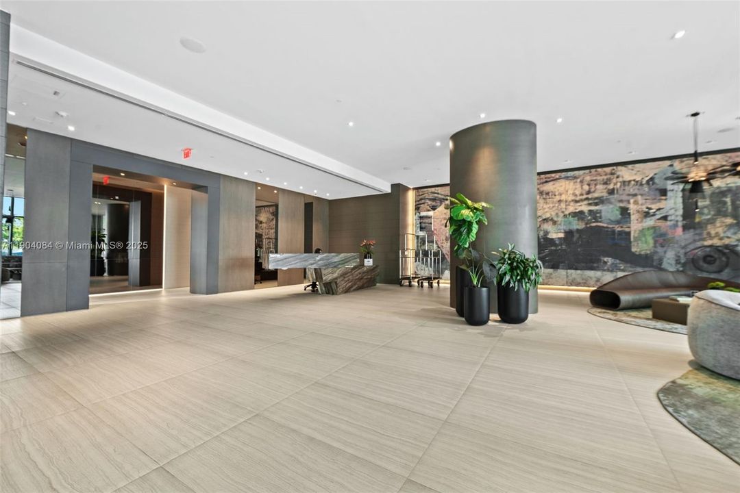 Elegant and modern lobby with 24-hour front desk and a welcoming contemporary design.