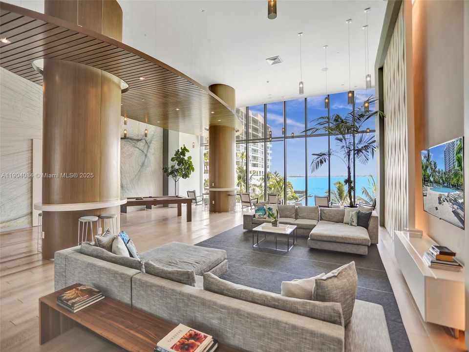 Elegant resident lounge with contemporary design, perfect for gatherings, meetings, or remote work.