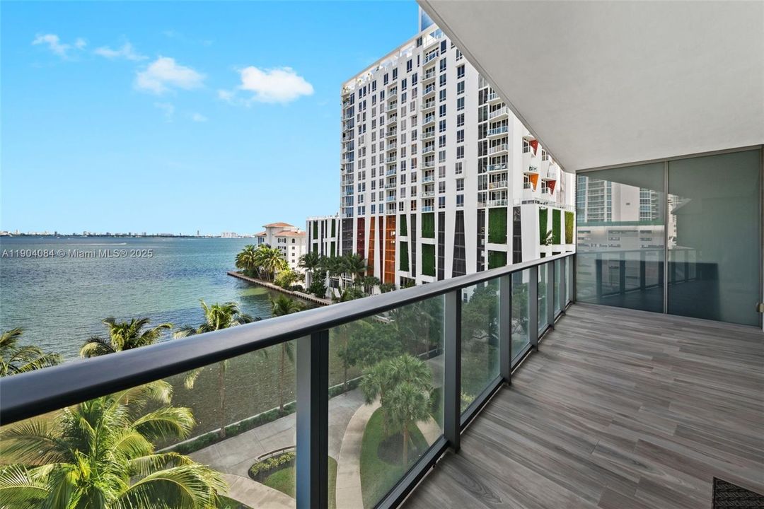 Large private balcony perfect for relaxing or entertaining while enjoying stunning water views.