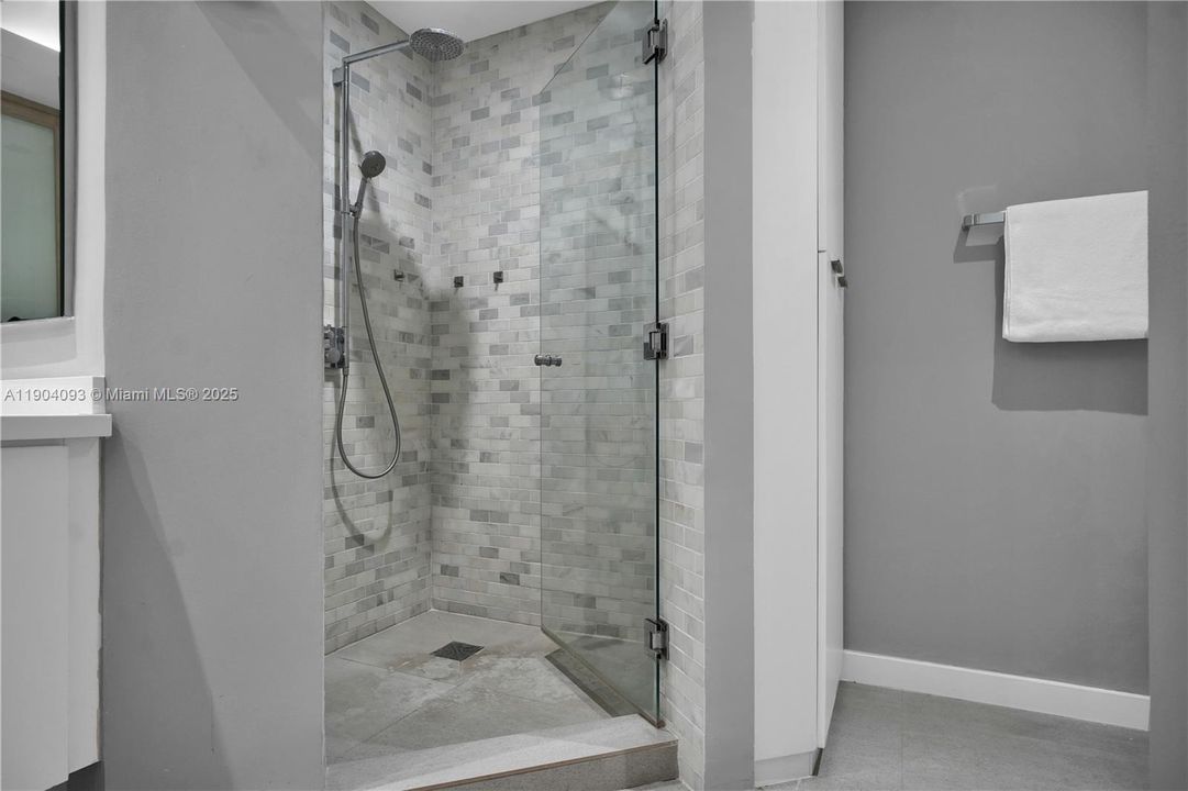 Walk-in shower, shimmering mosaic tile