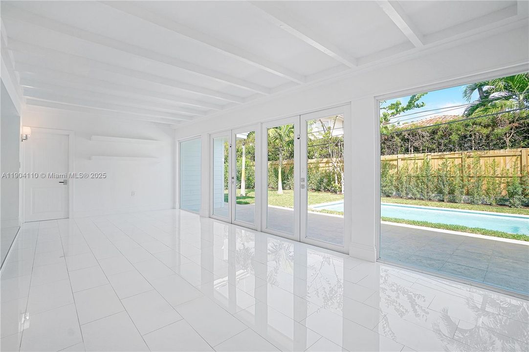 French Door open to the backyard patio with retractable awning.