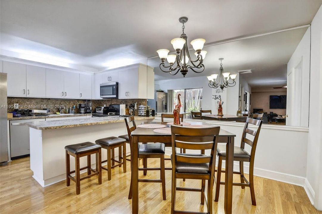 Spacious dining space seamlessly connected to the living room. Flat Ceilings