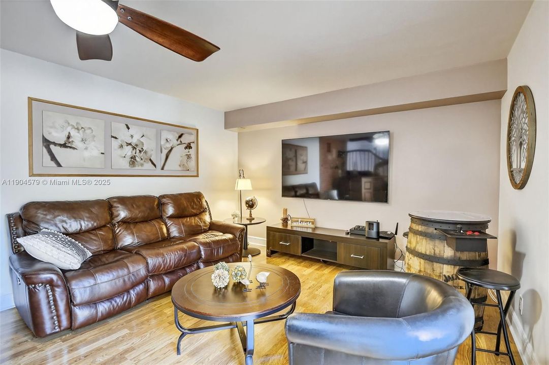 Bright open-concept / large living area filled with natural light and stylish laminate flooring & no popcorn ceilings.