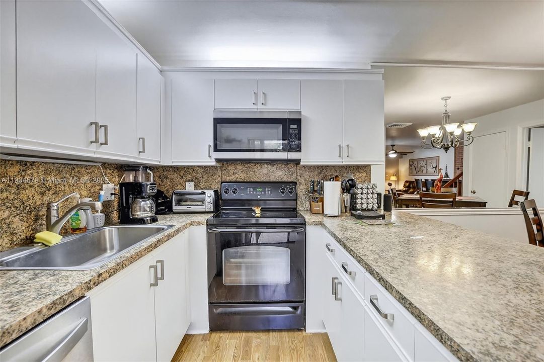 Modern kitchen featuring updated appliances, ample cabinetry, and a convenient layout for cooking and entertaining.