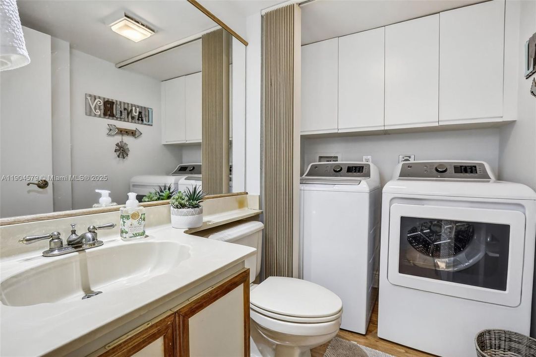 Convenient in-unit laundry with newer washer and dryer in powder room downstairs bathroom.