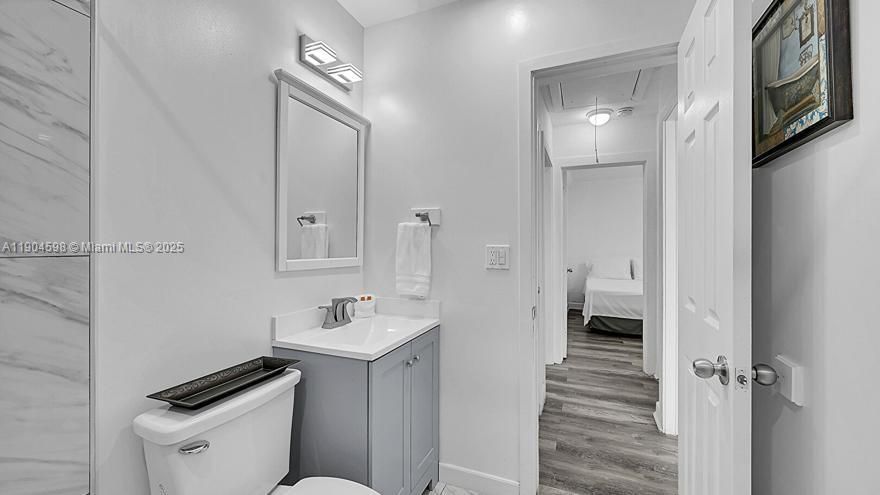 Drywall, Ensuite Bathroom, Half Bathroom, Marble Finish Floor, Recessed Lighting, Vanity, Vent, Wood Finish Floor, Baseboards Wall, Full Bathroom