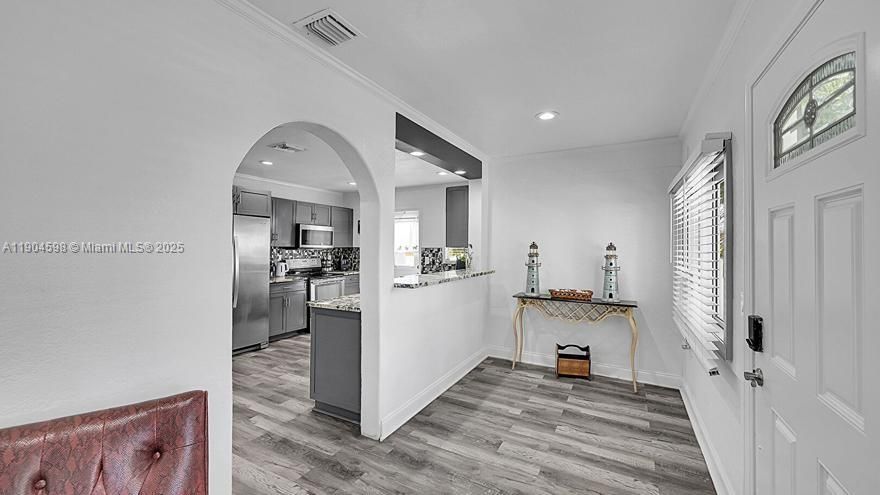 Arched Walkways, Baseboards Wall, Crown Molding, Drywall, Natural Light, Recessed Lighting, Smoke Carbon Monoxide Detector, Vent, Wood Finish Floor, Smoke Carbon Monoxide Detector, Vent