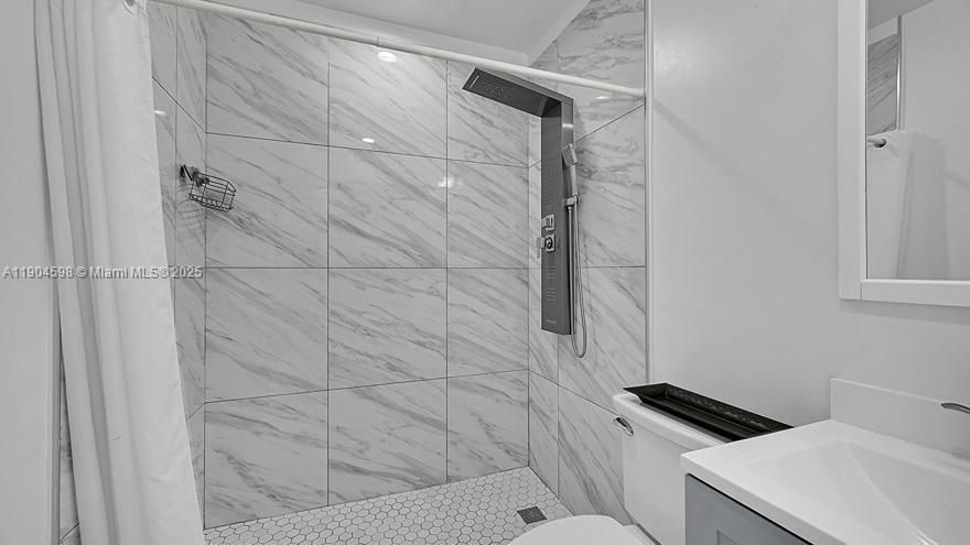 Drywall, Ensuite Bathroom, Half Bathroom, Marble Finish Floor, Recessed Lighting, Vanity, Vent, Wood Finish Floor, Baseboards Wall, Full Bathroom