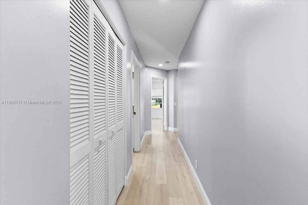 hallway to 3 of the secondary bedrooms and bathroom