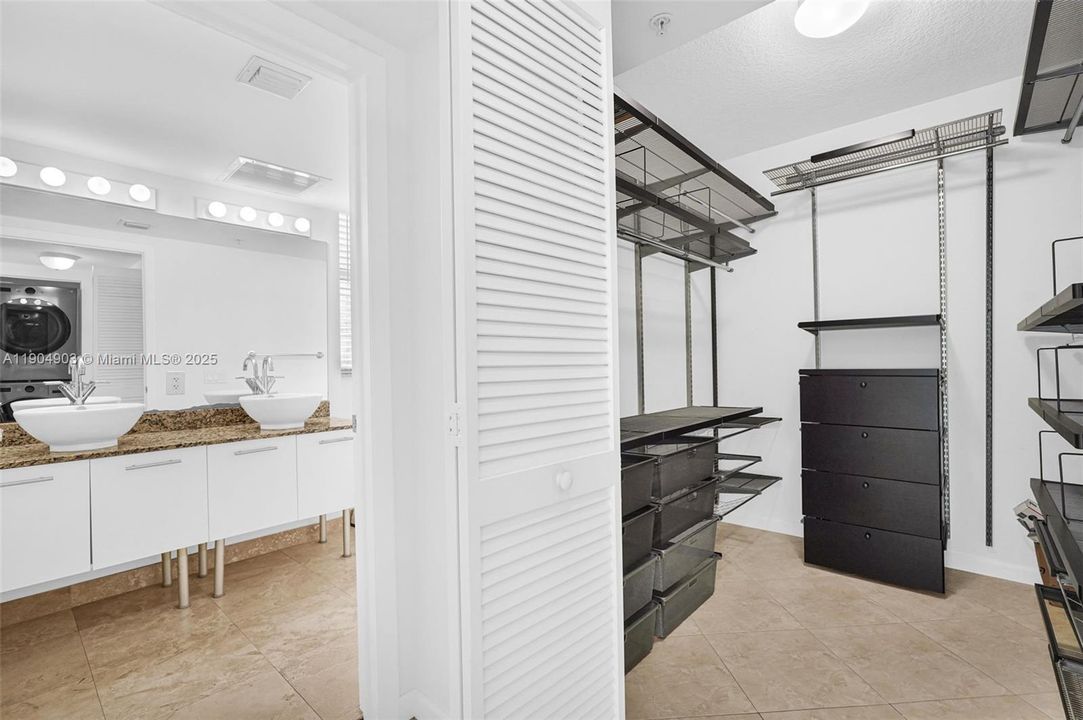 View from second floor hallway towards the primary Walk-in Closet and Primary Bathroom