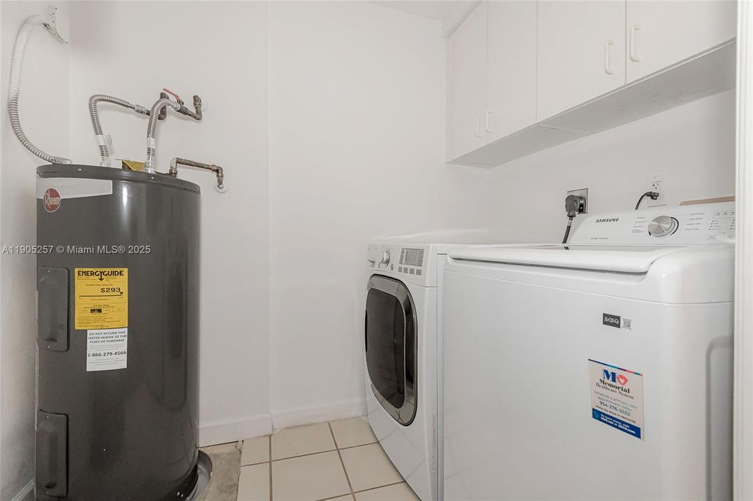 Laundry room with full size washer and dryer