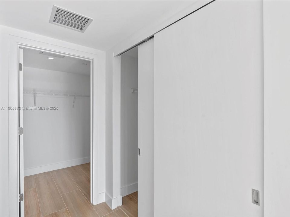 Primary comes with reach-in and walk-in closet