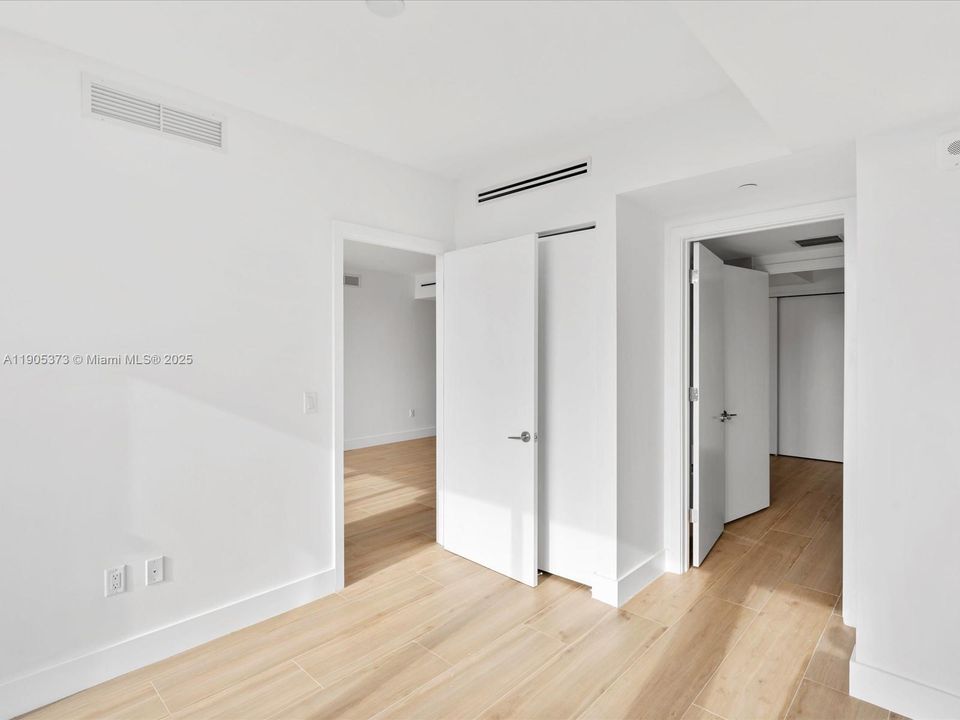 Second Bedroom with reach-in closet and linen closet