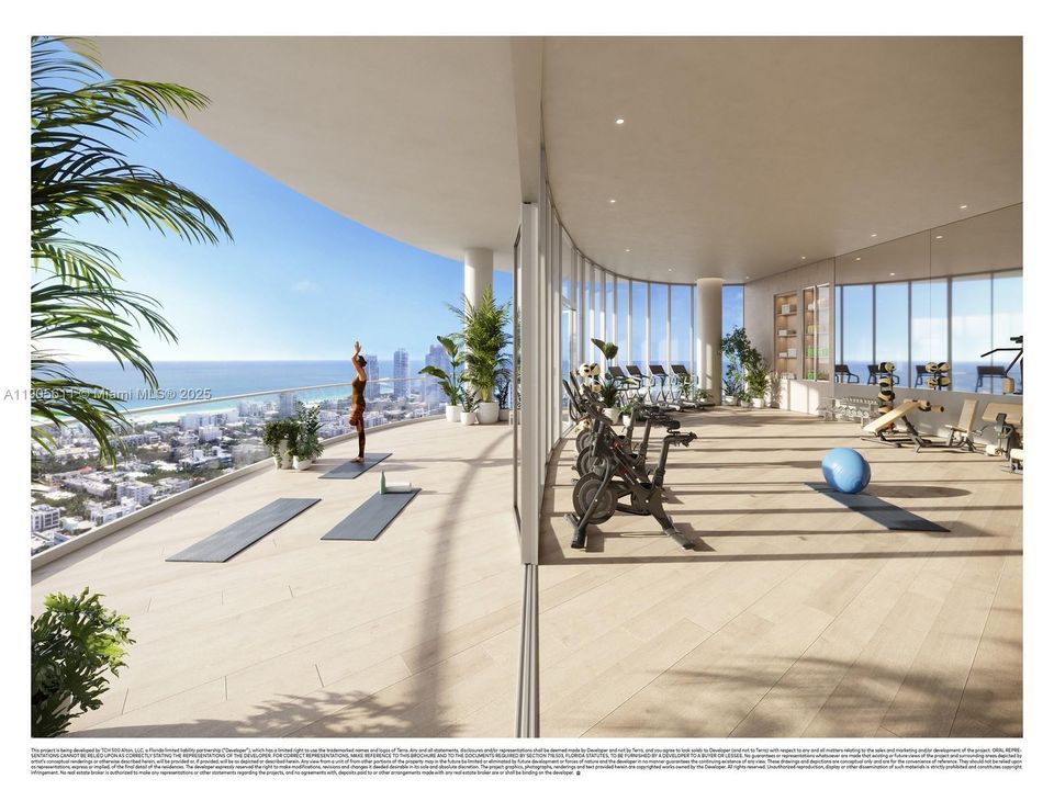 State-of-the-art fitness center and yoga terrace at Five Park Miami Beach with panoramic ocean views and modern wellness design.